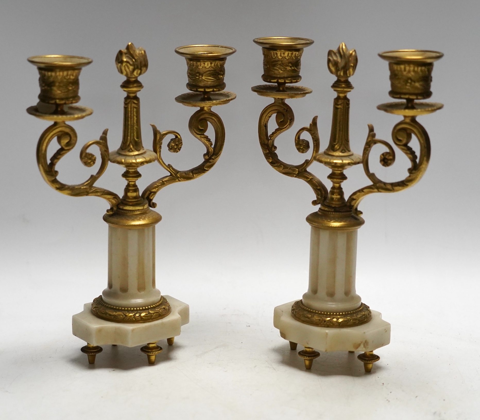 A pair of late 19th century alabaster and gilt metal two light candelabra, 22cm. Condition - good